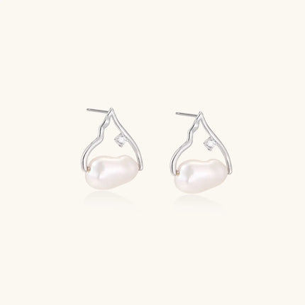 Silver mountain outline studs with baroque pearl and diamond accent on white background