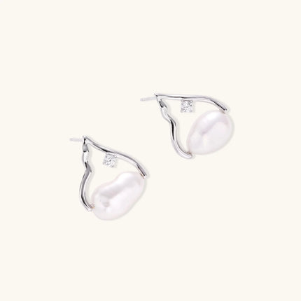 Silver mountain outline studs with baroque pearl and diamond accent on white background