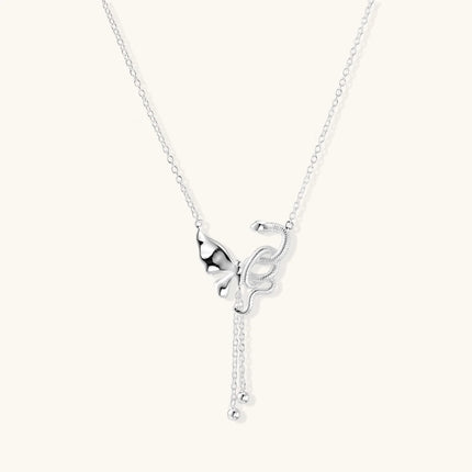 Sterling silver butterfly pendant with textured wing detail on adjustable Y-chain with ball drop ends