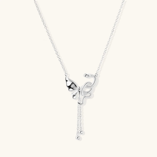Sterling silver butterfly pendant with textured wing detail on adjustable Y-chain with ball drop ends