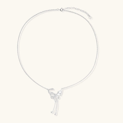 Sterling silver butterfly pendant with textured wing detail on adjustable Y-chain with ball drop ends