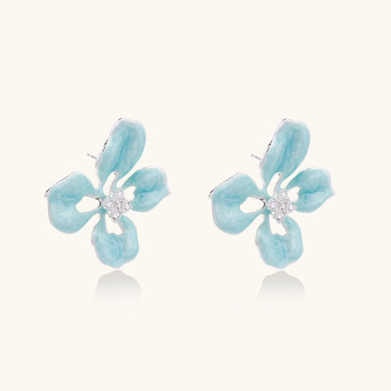 Turquoise enamel flower stud earrings with marbled finish and crystal centers on 18K gold plated brass