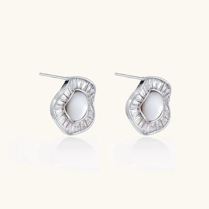 14K gold-plated stud earrings with freshwater pearl center surrounded by baguette-cut crystal halo in sunburst design