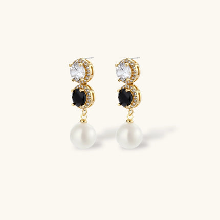 Gold-plated jewelry set with alternating black and clear cubic zirconia stones, featuring necklace, earrings and bracelet