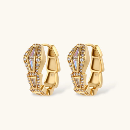 Gold-plated necklace with geometric diamond segments and matching huggie earrings featuring cubic zirconia details