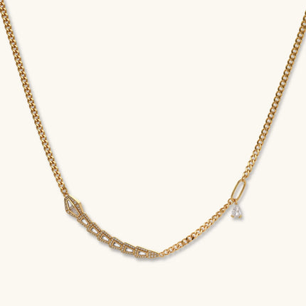 Gold-plated necklace with geometric diamond segments and matching huggie earrings featuring cubic zirconia details