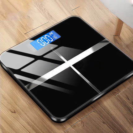 Black glass electronic scale with blue LCD display, 396 lb capacity, switchable KG/LB, temperature readout.