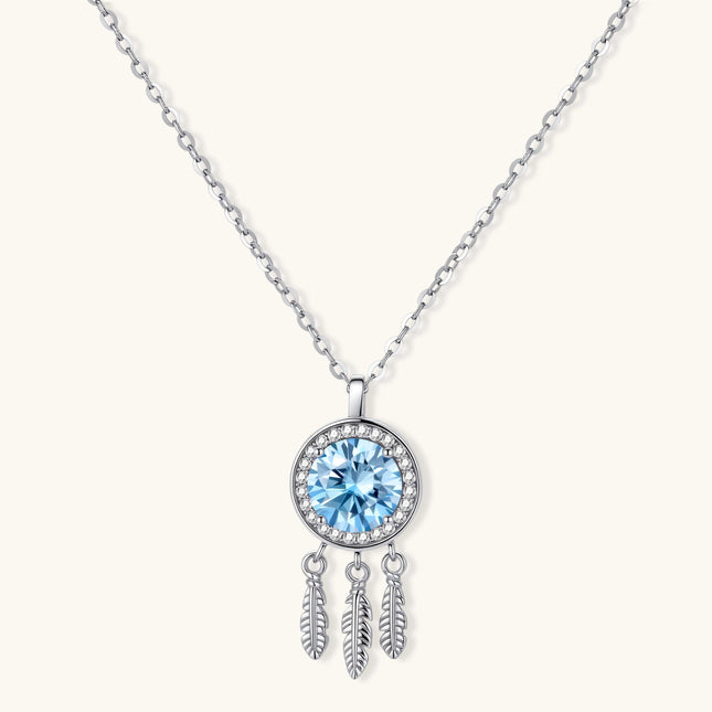 Sterling silver dreamcatcher pendant with blue moissanite center and three feather charms on adjustable chain.